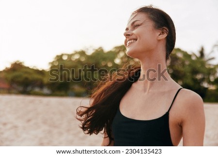 woman beach sunset lifestyle summer sand ocean vacation smile sea jean