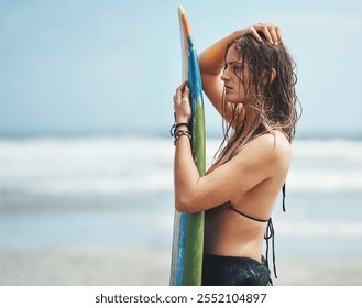 Woman, beach and surfer thinking on vacation, tropical island and outdoor nature for hobby. Female person, bikini and ponder sea waves on weekend trip, contemplating and tourist on ocean holiday - Powered by Shutterstock