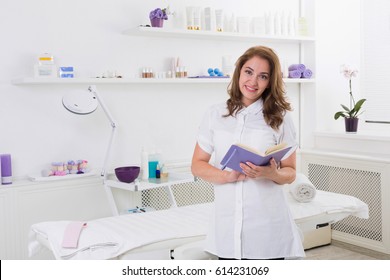 Woman beautician doctor at work in spa center. Portrait of a young female professional cosmetologist. Female employee in cosmetology cabinet or beauty parlor. Healthcare occupation, medical career