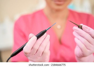 Woman Beautician Holds Radio Wave Scalpel In Her Hands