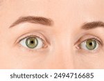 Woman with beautiful green eyes, closeup view