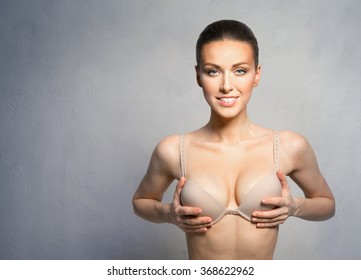 Woman With Beautiful, Large Breasts, Happy After Plastic Surgery.