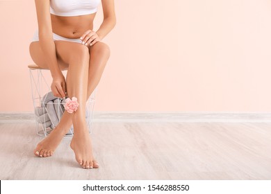 Woman With Beautiful Legs After Depilation Near Color Wall