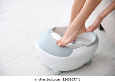 Woman With Beautiful Legs Using Foot Bath At Home, Closeup With Space For Text. Spa Treatment