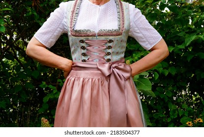 a woman in a beautiful traditional Bavarian dirndl dress at the Bavarian October fest (Oktoberfest) (Munich, Bavaria, Germany) - Shutterstock ID 2183504377