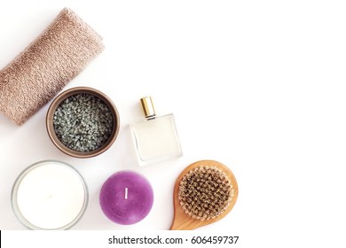 Woman Beauty Blogger Spa Cosmetic Products, Body Brush, Towel, Candles On White From Above. Copyspace