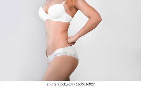 Woman Beauty, Body Care. Slender Line Of A Beauty Young Body In Underwear.