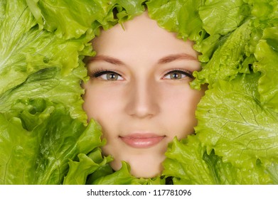 Woman Beauty Face With Green Salad Frame