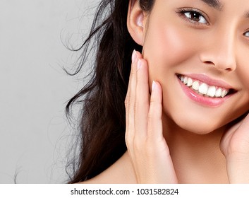 Woman Beauty Face Portrait Isolated On Gray With Healthy Skin And White Teeth Smile. Studio Shot.