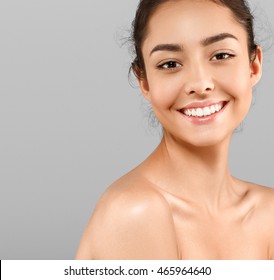 Woman Beauty Face Portrait Isolated On Gray With Healthy Skin And White Teeth Smile