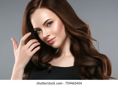 Woman beauty healthy skin and hairstyle, brunette with long hair over dark background female portrait. Studio shot. - Shutterstock ID 759465454