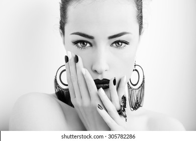 woman beauty portrait with black lips and black white nails, studio