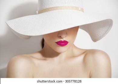 Woman Beauty Portrait With Pink Lips And Summer White Hat, Studio