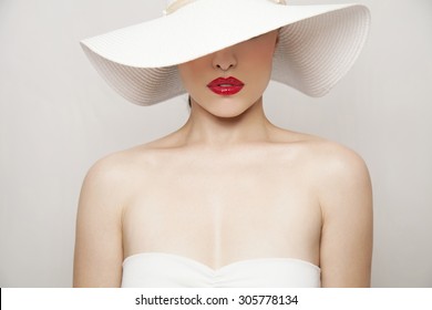 Woman Beauty Portrait With Red Lips And Summer White Hat, Studio