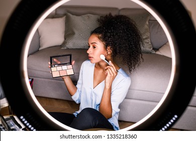 Woman Beauty Vlogger Recording A Makeup Tutorial On Camera Using Ring Light