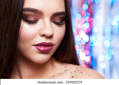 Woman with beautyful make-up  shiny glitter and snow