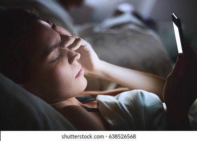 Woman In Bed With Phone, Headache