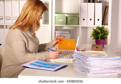 The Woman Behind The Desk In The Office