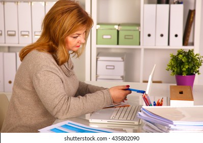 The Woman Behind The Desk In The Office