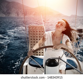 Woman behind the wheel yacht, enjoying sea nature and mountains landscape, active sailor girl, female driving luxury water transport, summertime concept
