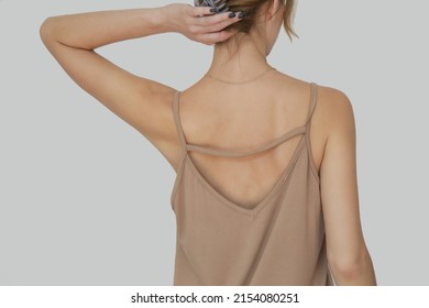 Woman In Beige Cotton Camisole Shirt, Studio Shot.