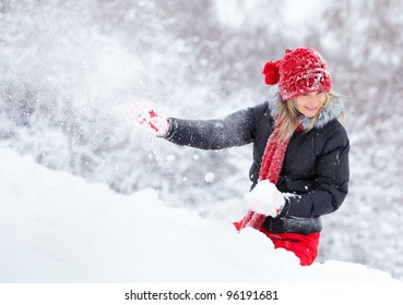 Woman Being Hit By A Snow Ball In Wintertime.