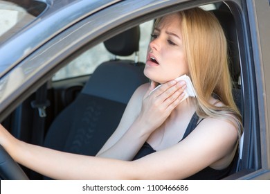 Woman being hot during a heat wave in car 