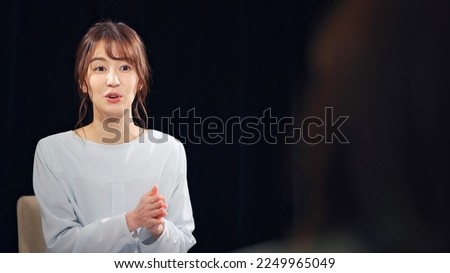 A woman being interviewed. documentary program.