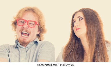 Woman Being Irritated Looking Displeased At Her Friend Or Boyfriend Being Silly, Fooling Around And Being Dumb. Couple Relatioships Problems.