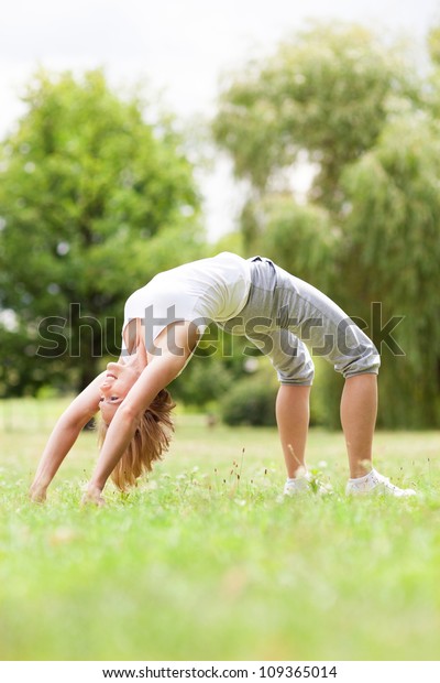 Woman bending over\
backwards