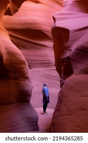 Woman Between Rocks In Antelope Canyon