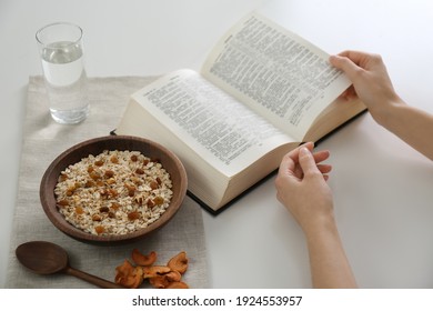 Woman With Bible Having Dinner At Home, Closeup. Great Lent Season