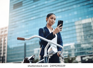 Woman, bicycle and cellphone in city for business, sustainable travel and app for directions. Technology, internet and professional person in street with transport and online for commute and journey - Powered by Shutterstock