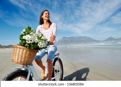 Woman With Bicycle On Beach In Cape Town, South Africa And Table Mountain