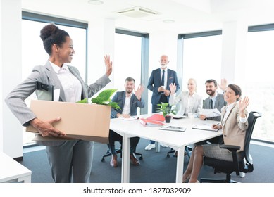 Woman bids goodbye to her colleagues - Powered by Shutterstock