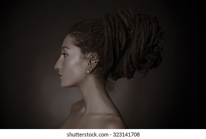 Woman With A Big Dreadlocks Bun Hairstyle