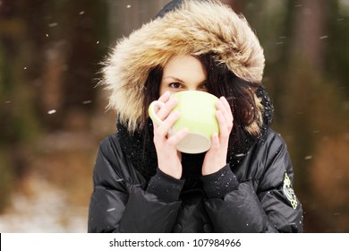 Woman With Big Mug Of Hot Drink During Cold Day.