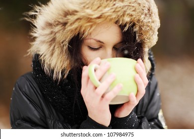 Woman With Big Mug Of Hot Drink During Cold Day.