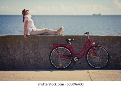 Woman And Bike In City 