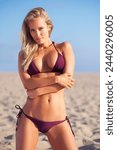 Woman, bikini and portrait on beach for swimwear, summer and travel for tan and relax on sand for holiday. Young person and attractive with body for trip, sunshine and ocean for season and outdoor