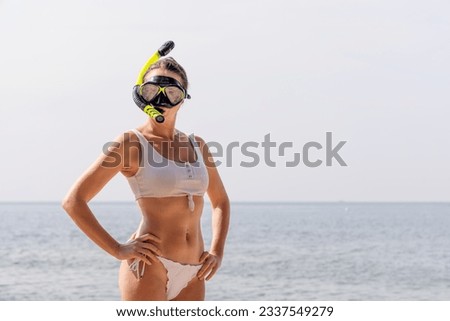 Woman in bikini and snorkeling mask. Summer travel vacation