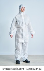 Woman in bio-hazard suit on white background. - Shutterstock ID 1708698463