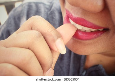 Woman Biting Her Fingernails