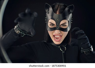 A Woman In Black Belt And Cat Mask Emotional Portrait