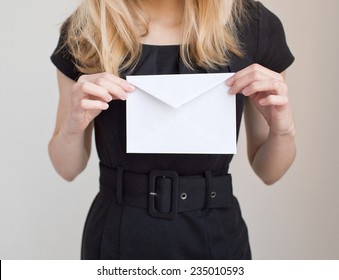 Woman In Black Dress Holding  White Envelope