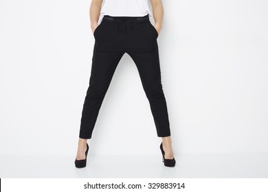 Woman In Black Heels And Trousers, Low Section