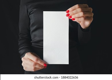 Woman In Black Holding DL Flyer Mockup.