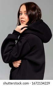 Woman in black hoodie, mockup for logo or branding design