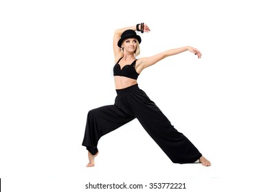 Woman in black suit dance on the white background