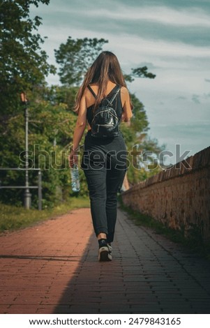 Similar – Image, Stock Photo Brunette girl holding surfboard over head and walking